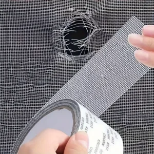 Strong adhesive fiberglass screen repair tape for fixing window and door screens.