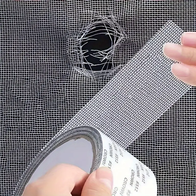 Strong adhesive fiberglass screen repair tape for fixing window and door screens.