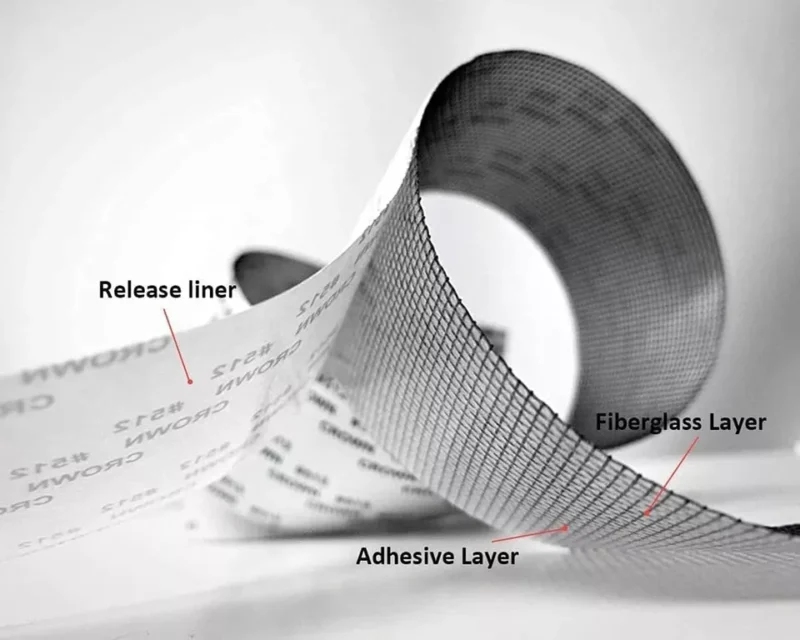 Strong adhesive fiberglass screen repair tape for fixing window and door screens.